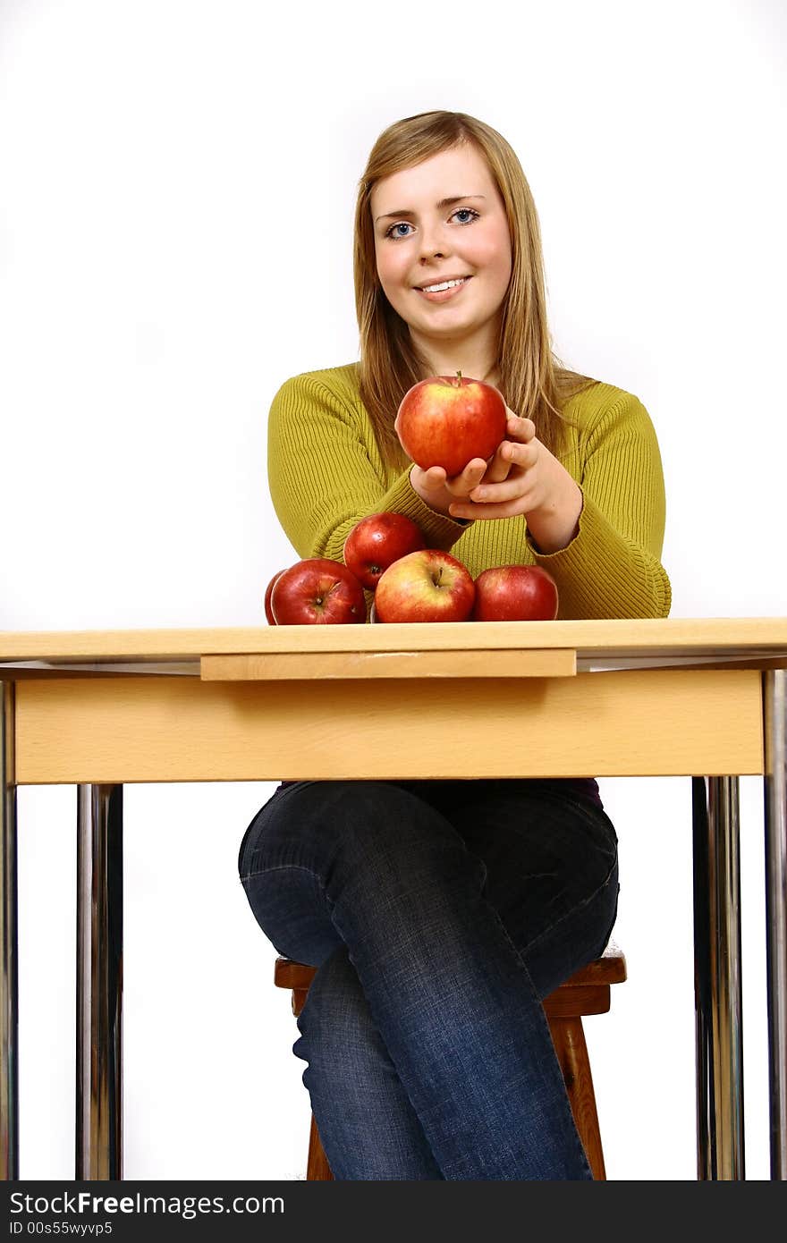 Beautiful young woman holding a apple