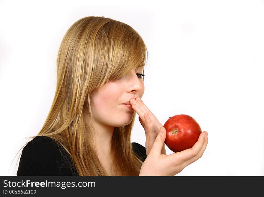 Beautiful young woman holding a apple