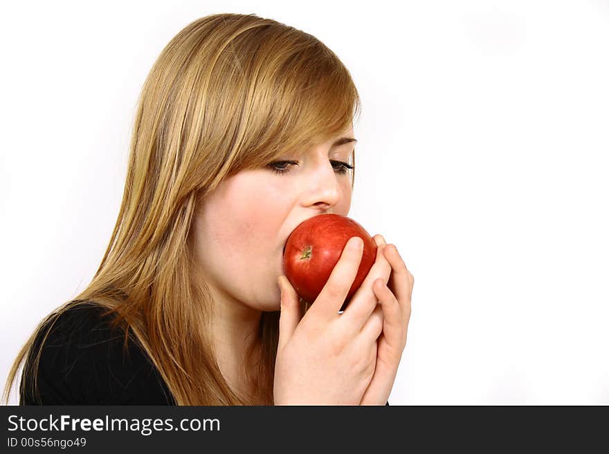 Beautiful young woman holding a apple