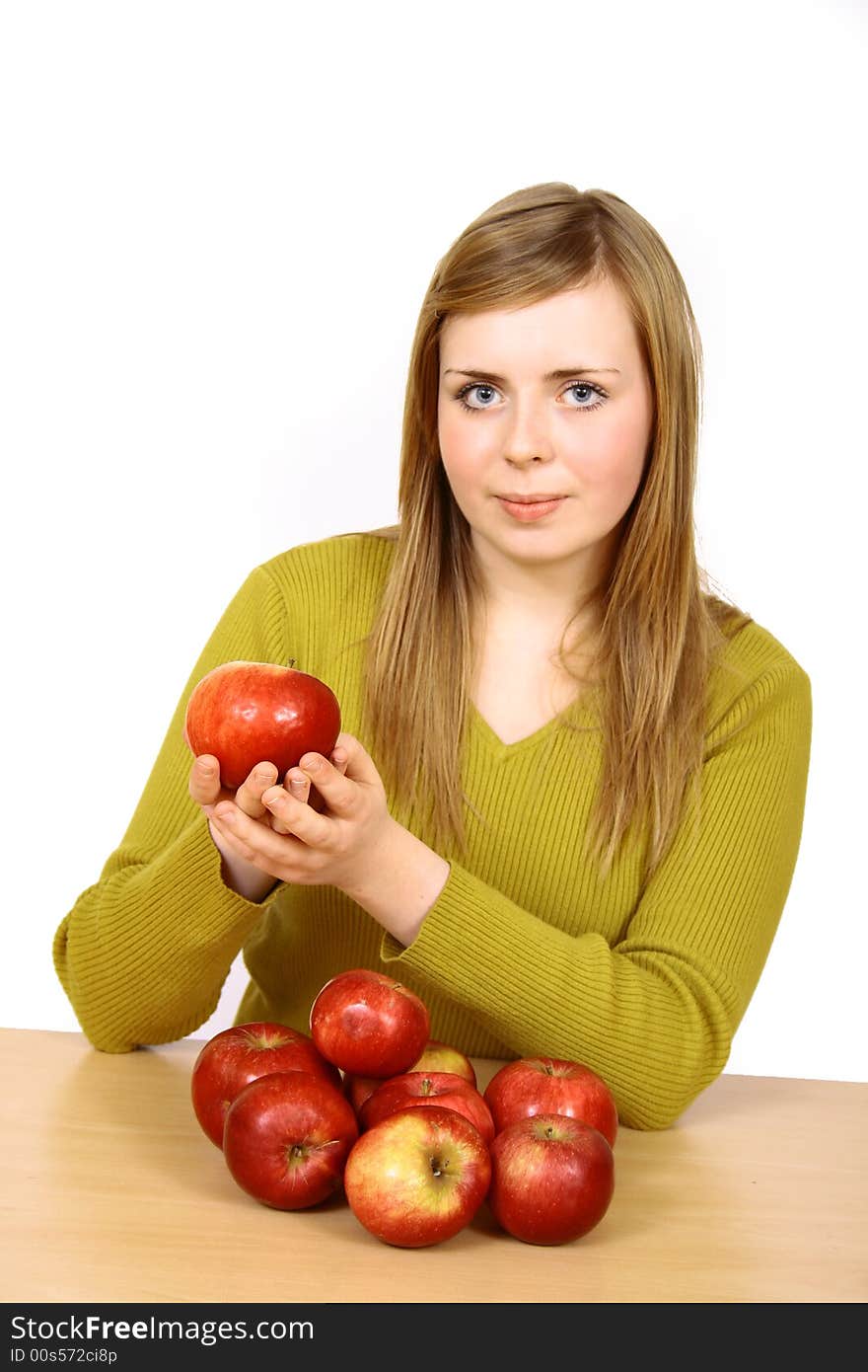 Beautiful young woman holding a apple