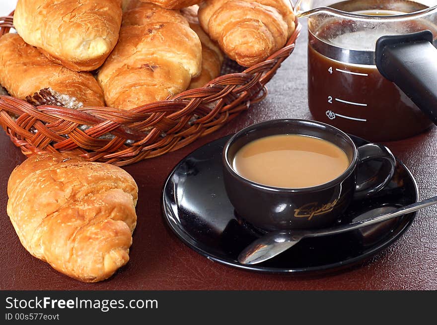 Cup Of Coffee With Fresh Croissants