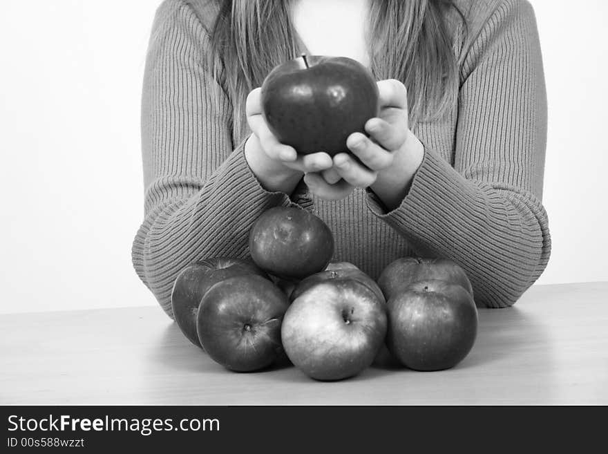 Beautiful young woman holding a apple