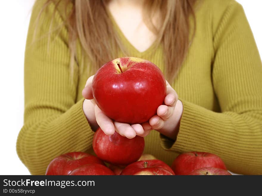 Beautiful young woman holding a apple