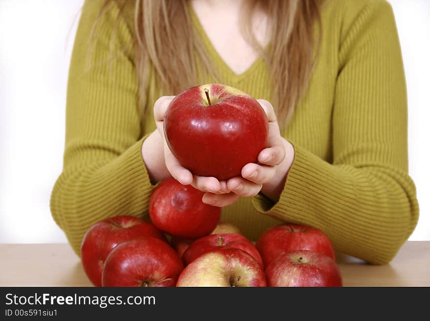 Beautiful young woman holding a apple