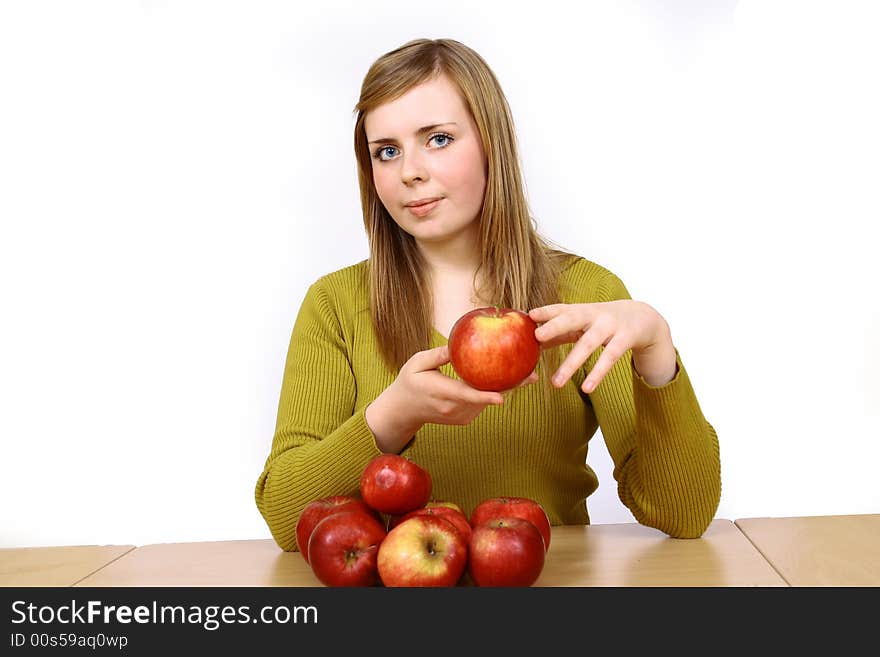 Beautiful young woman holding a apple