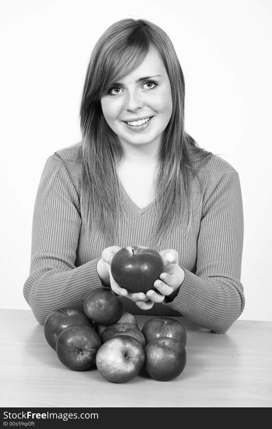 Beautiful young woman holding a apple