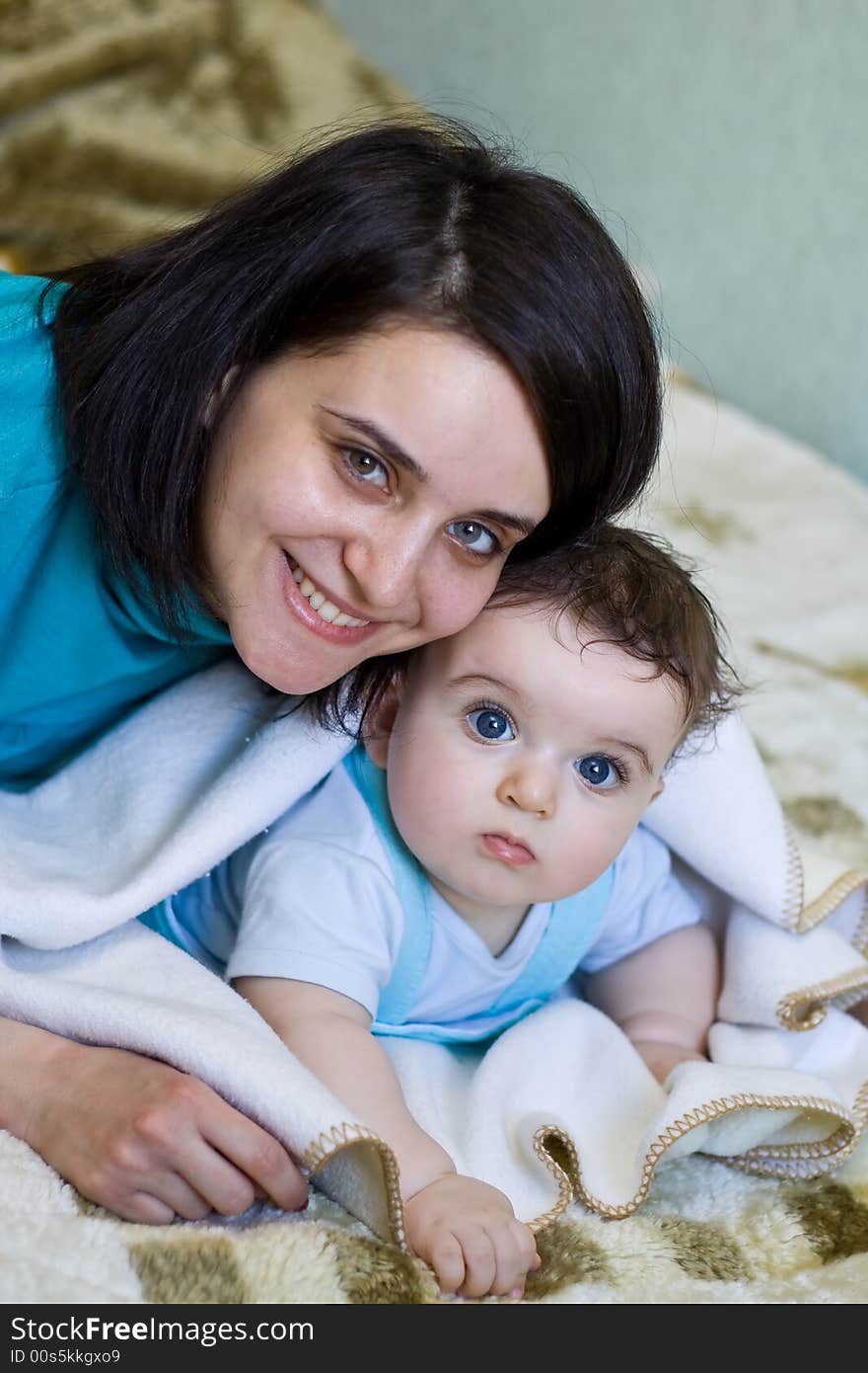 Mum Embracing The Small Son To Which 7 Months