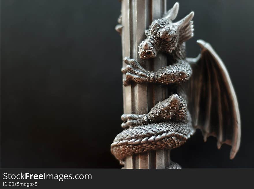 A dragon weeved around a pillar. A dragon weeved around a pillar