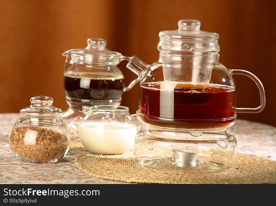 Glass teapot  and sugar bowl on the table