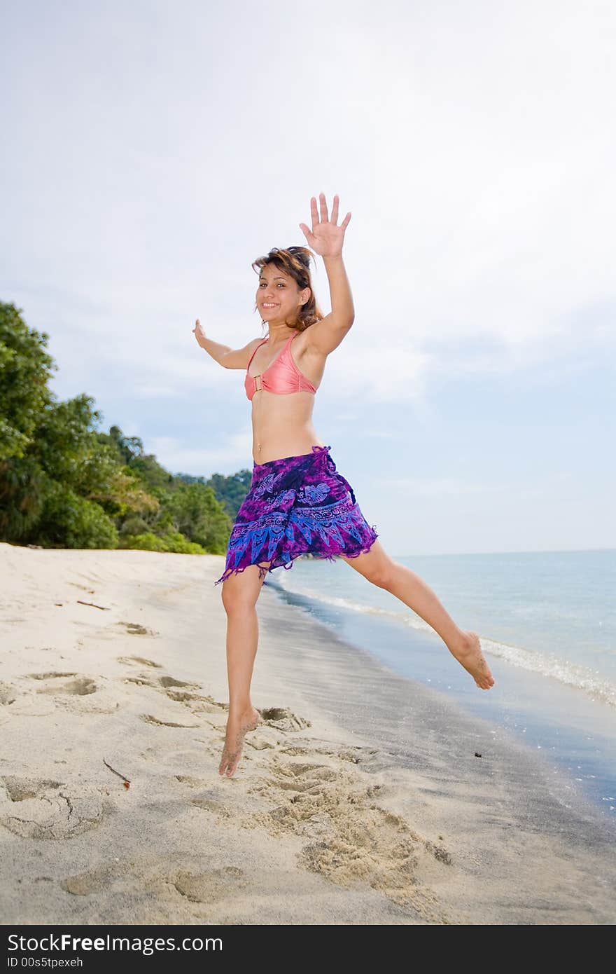 Jumping Freely At The Beach