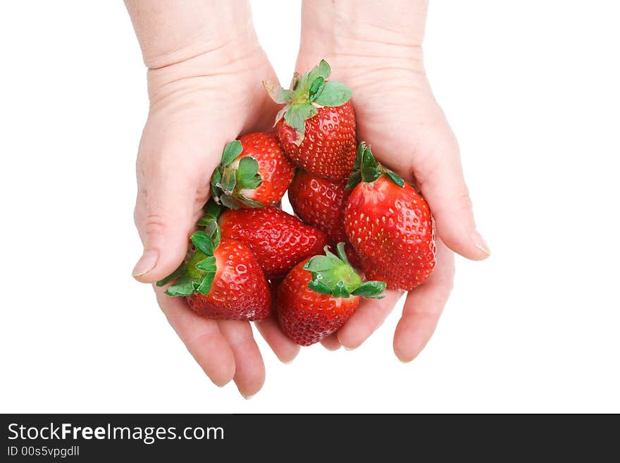 Two hands hold a strawberry isolated on a white background