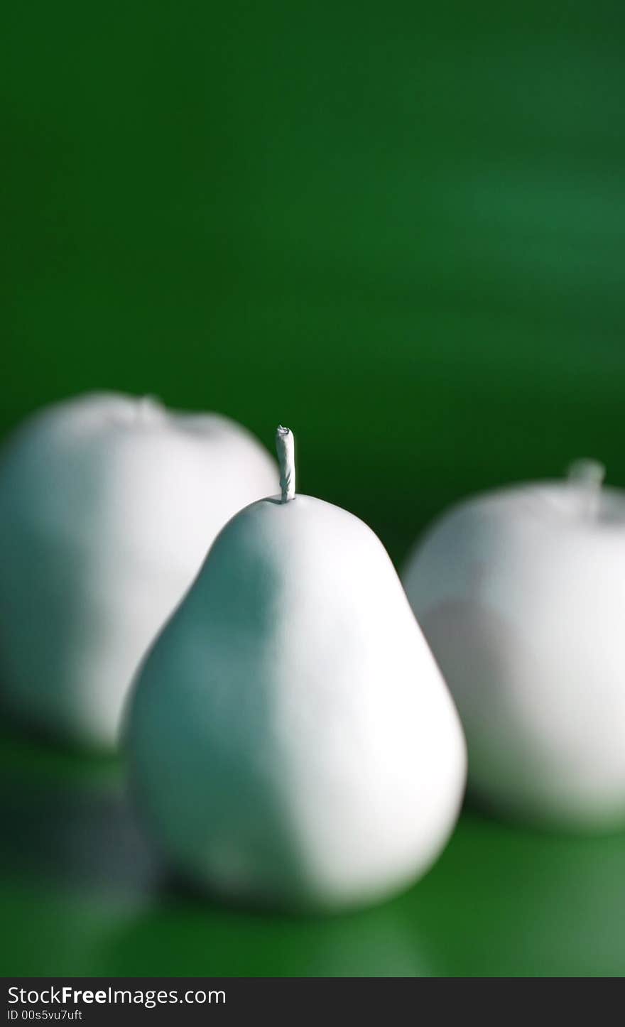 Arraignment of white artificial fruit with special focus technique. Arraignment of white artificial fruit with special focus technique