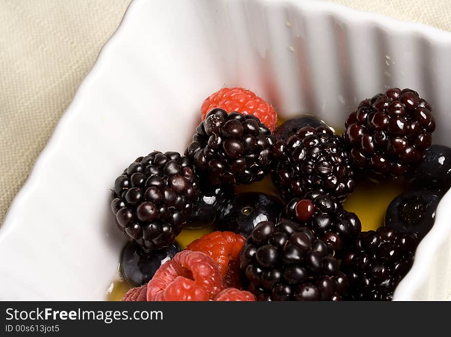 Healthy white bowl of ripe fruit in syrup. Healthy white bowl of ripe fruit in syrup