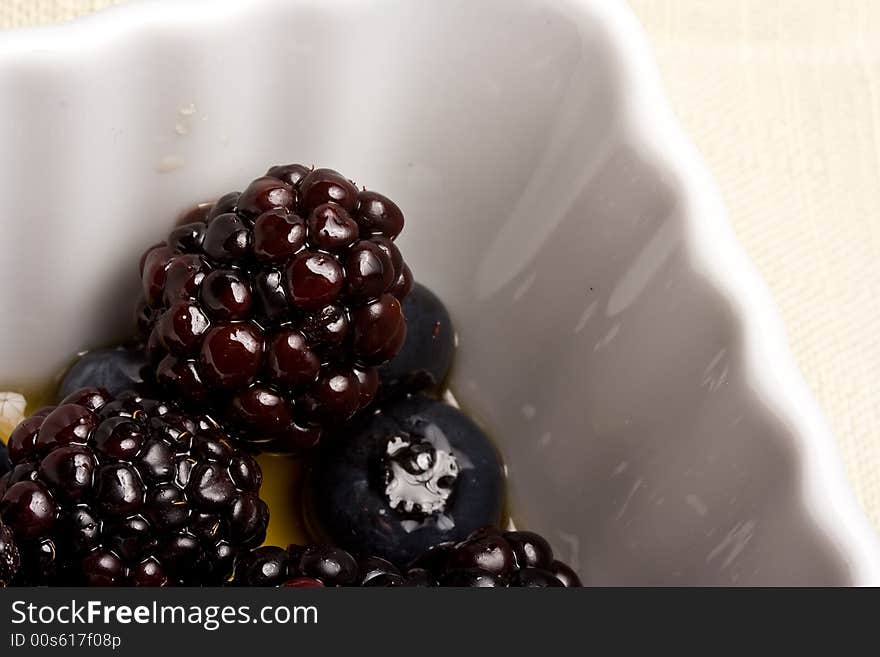 Healthy white bowl of ripe fruit in syrup. Healthy white bowl of ripe fruit in syrup