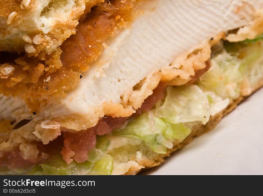 Buffalo bbq chicken sandwich on a white plate