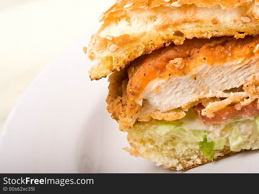 Buffalo bbq chicken sandwich on a white plate