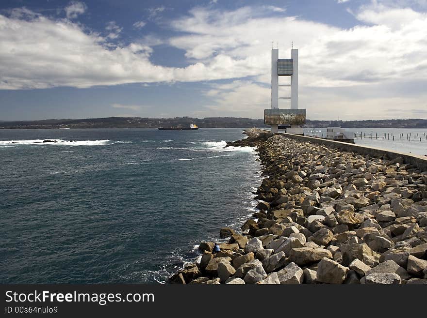 Dike with tower of maritime control