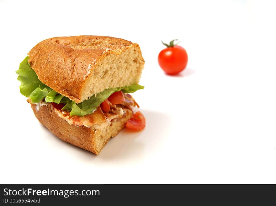 Bacon Sandwich with bacon, lettuce, tomato and mayo on whole wheat coarse bread bun