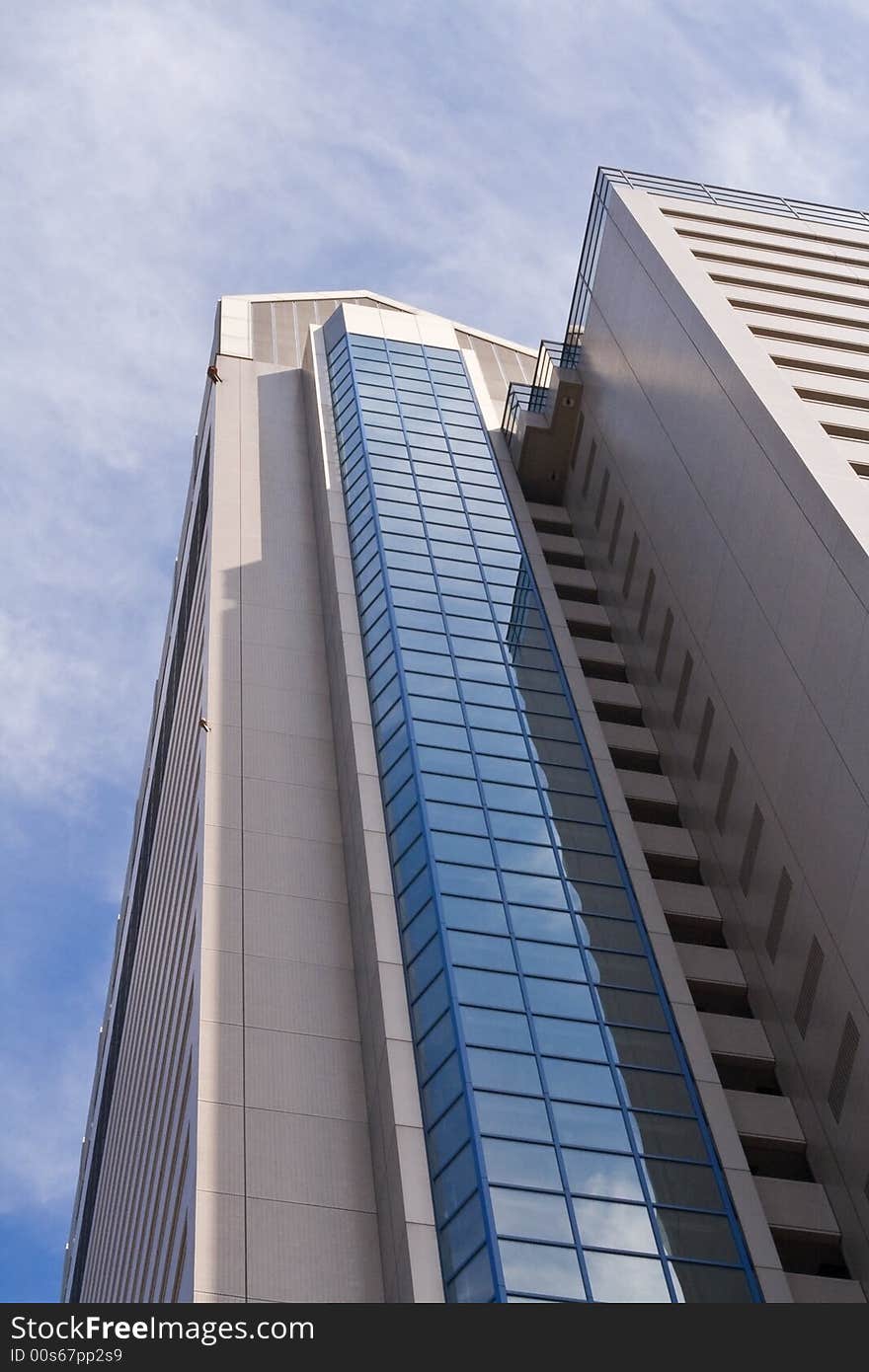 Image of a high skyscraper and a cloudy sky. Image of a high skyscraper and a cloudy sky.