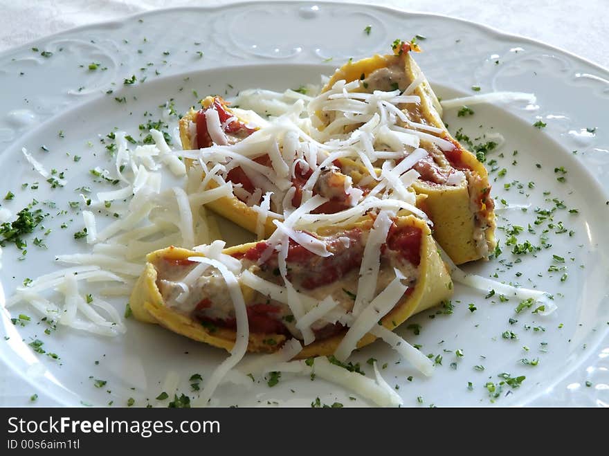 Italian dish with pasta, fish and tomato