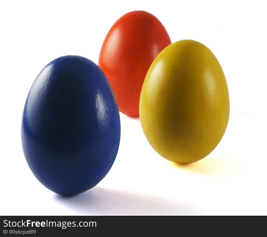 Three coloured eggs isolated on white. Three coloured eggs isolated on white