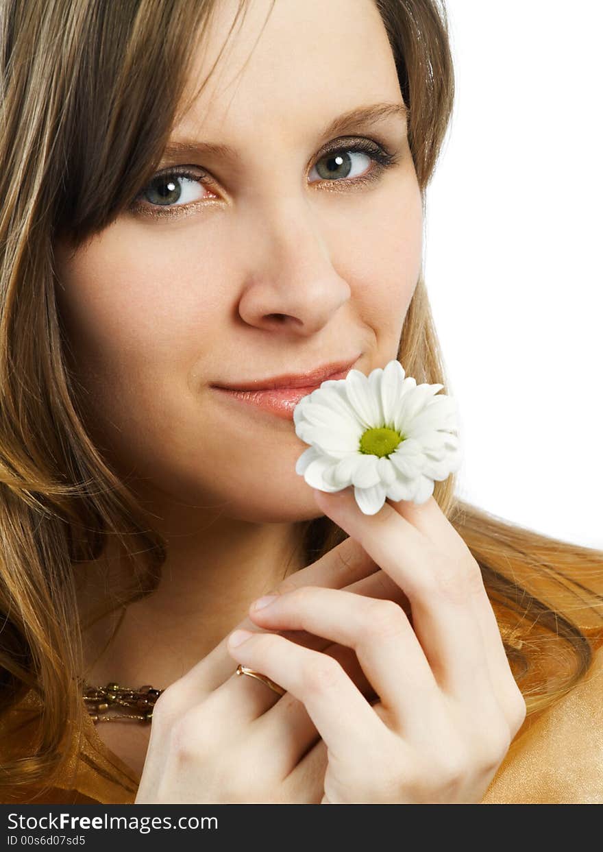 Smiling girl with daisy at hair on white background. Smiling girl with daisy at hair on white background