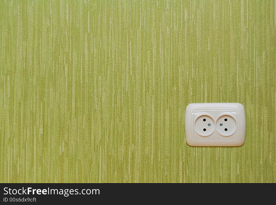 Wall-outlet on the green wall