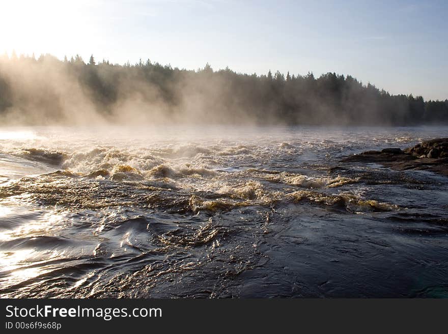 August foggy morning: river, forest, rock