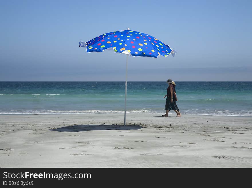 Women and beach umbrella