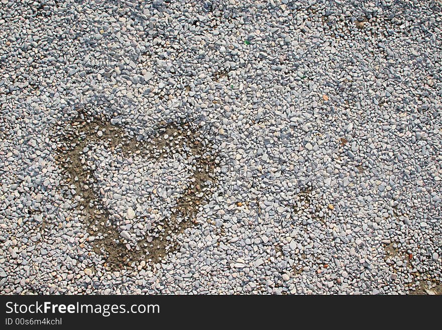 Painted heart over small stones and rocks. Painted heart over small stones and rocks