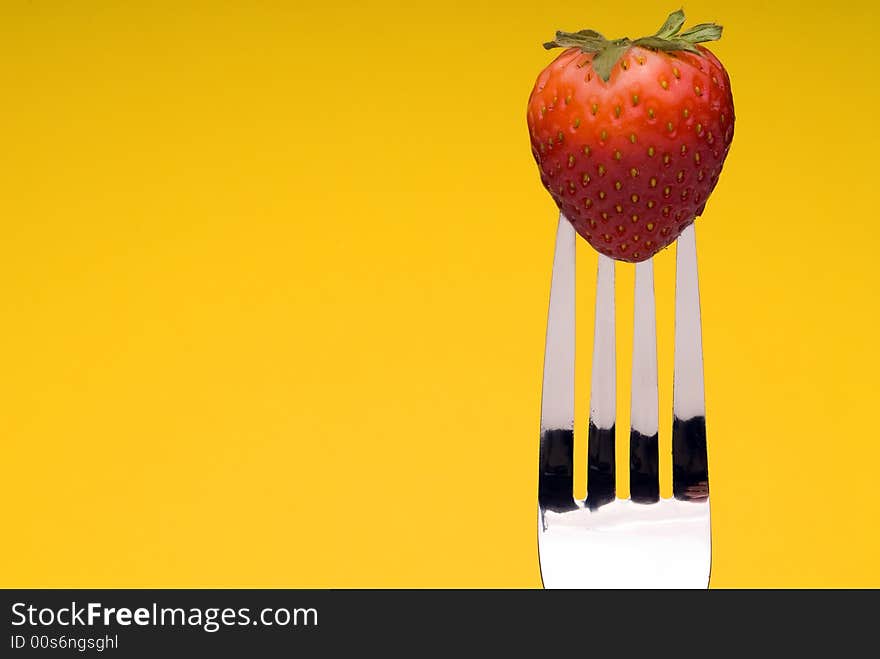 Strawberry on Fork - yellow background