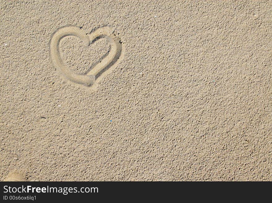 Heart over sand can be used as a background. Heart over sand can be used as a background