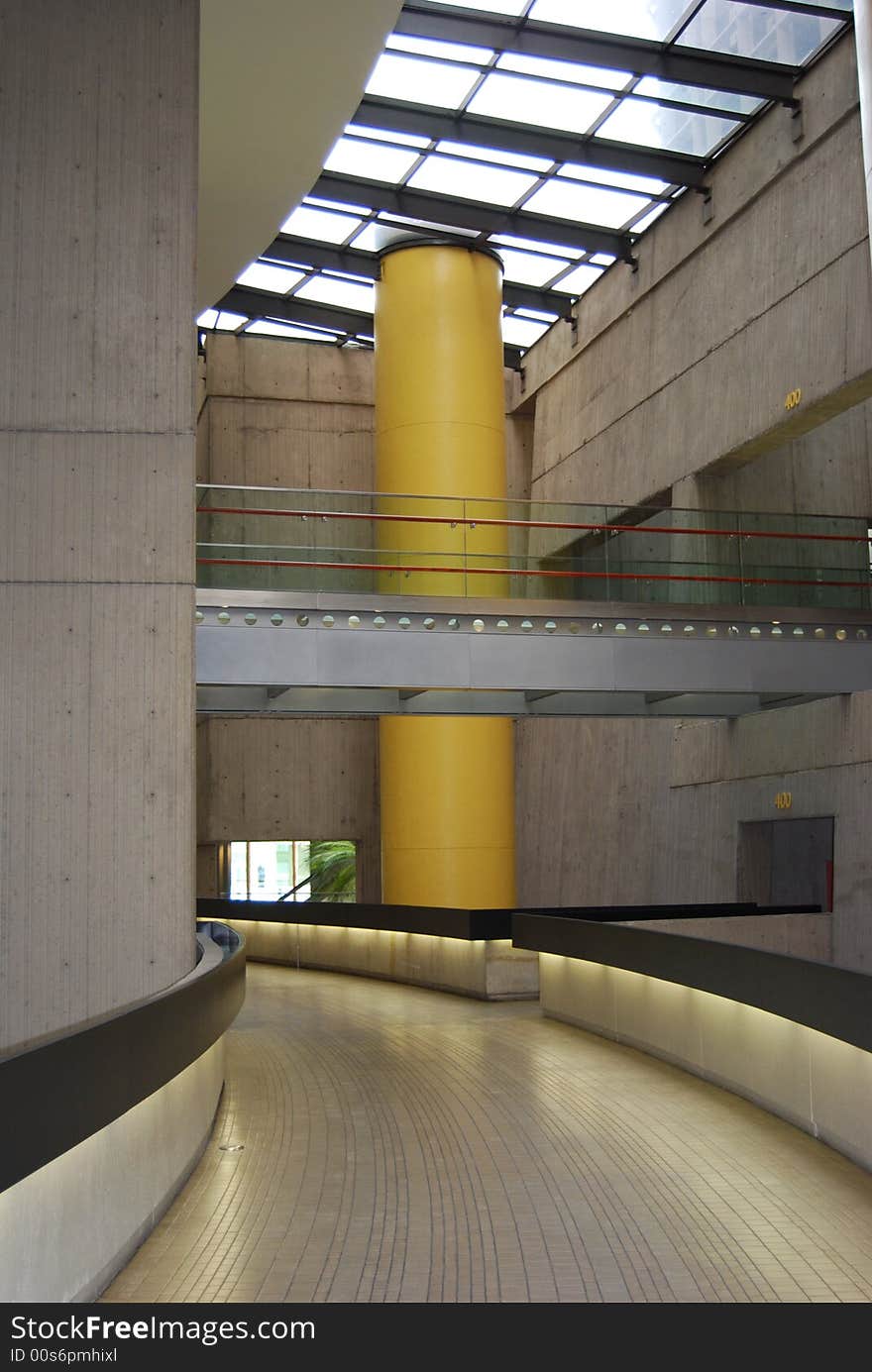 Looking down a curved walkway in the base of a tower.