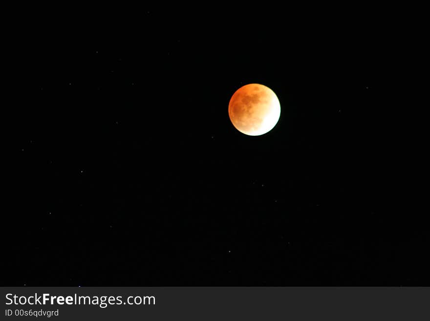 Moon closeup and stars at the end of a lunar eclips