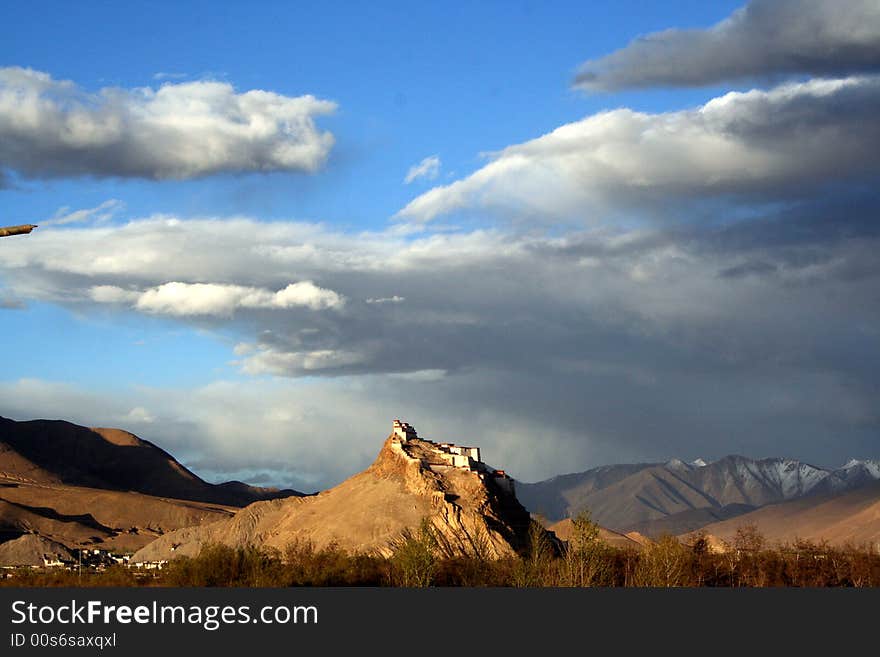 In Gyangze, an ancient tibetan castle seat on the mountain top with the sunlight. In Gyangze, an ancient tibetan castle seat on the mountain top with the sunlight