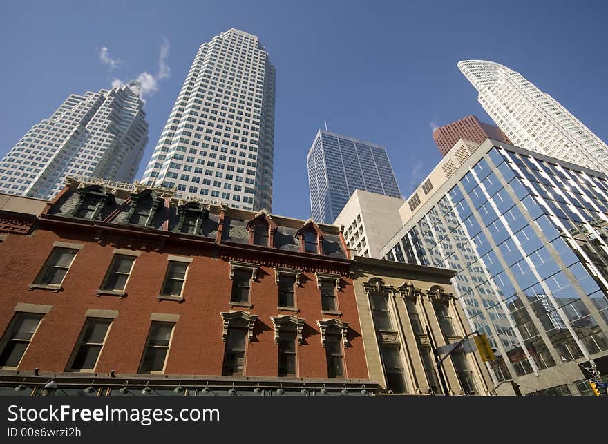 Historic buildings and skyscrapers merge in downtown Toronto.