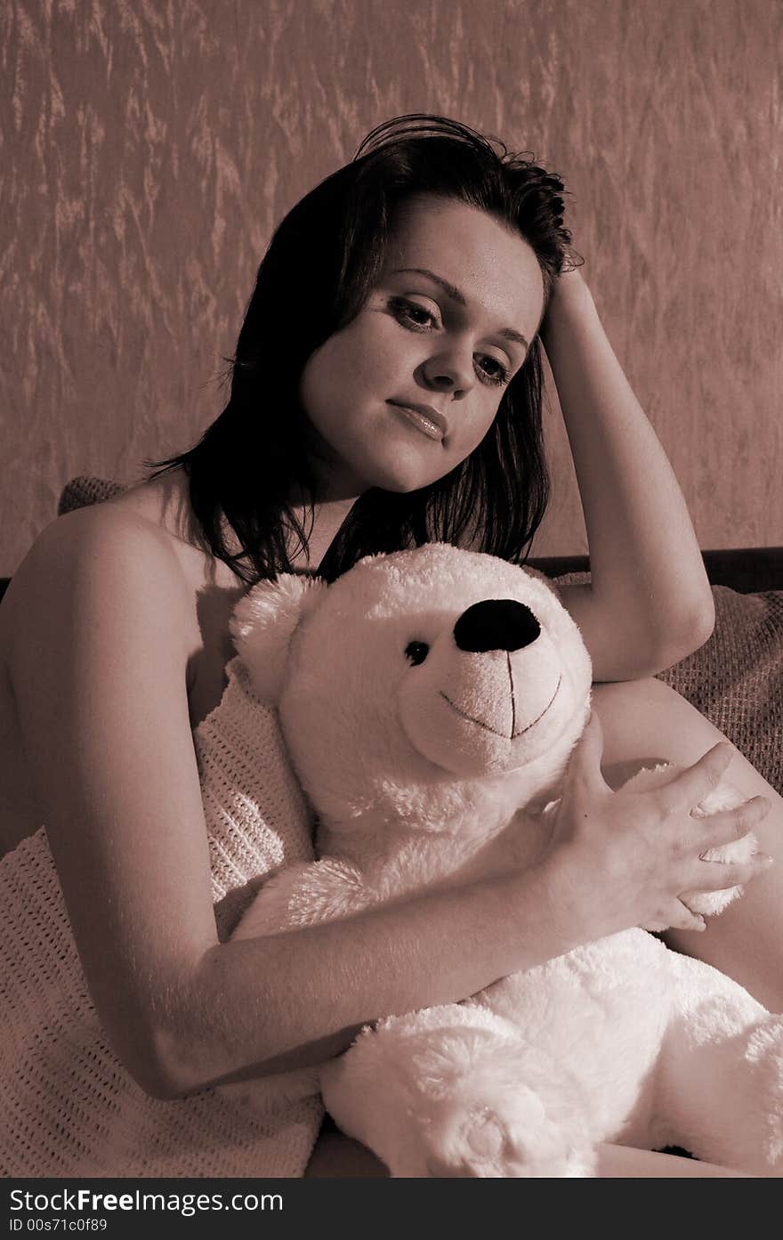 Beautiful girl with a toy bear