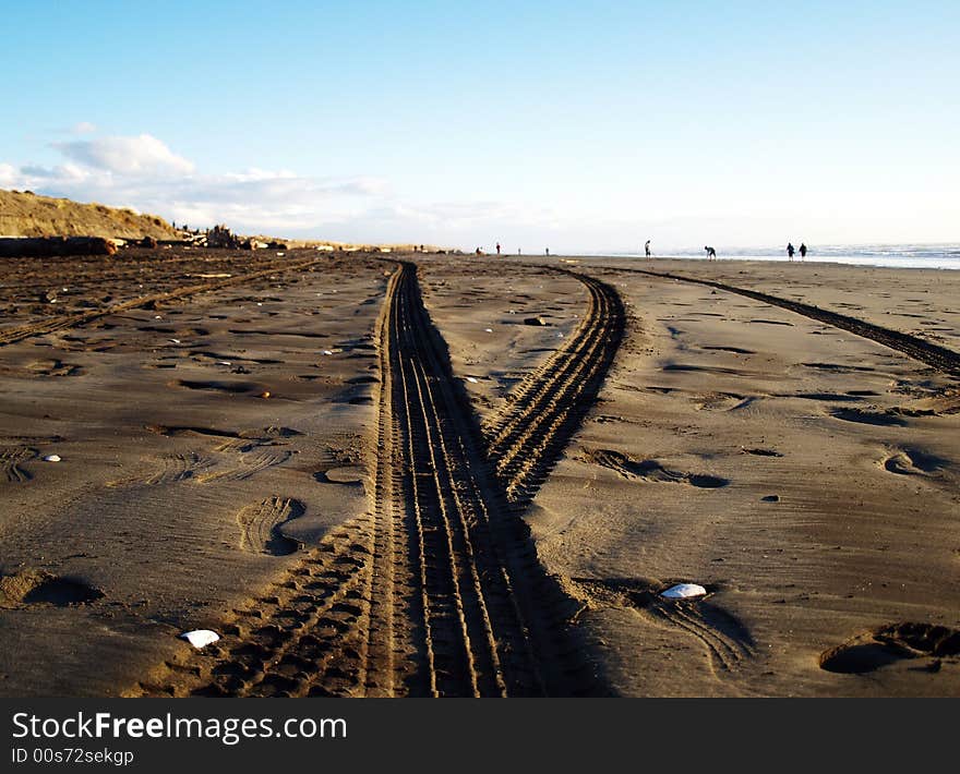 Crossing tyre prints on a sand