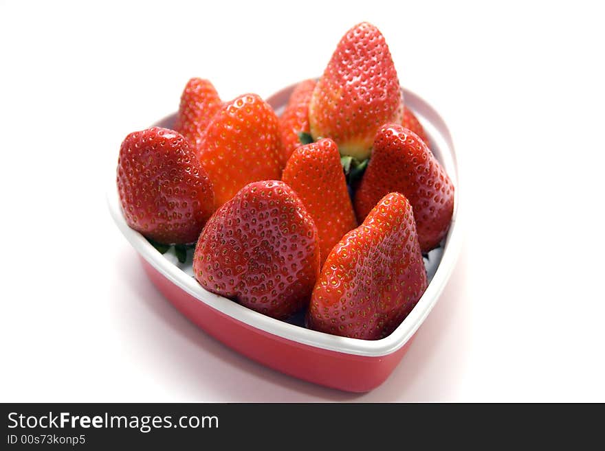 Strawberry in a heart shape box. desert in the winter