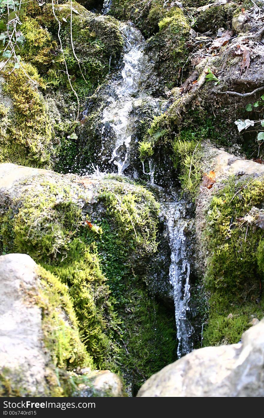 Stream of water falling downwards. Stream of water falling downwards