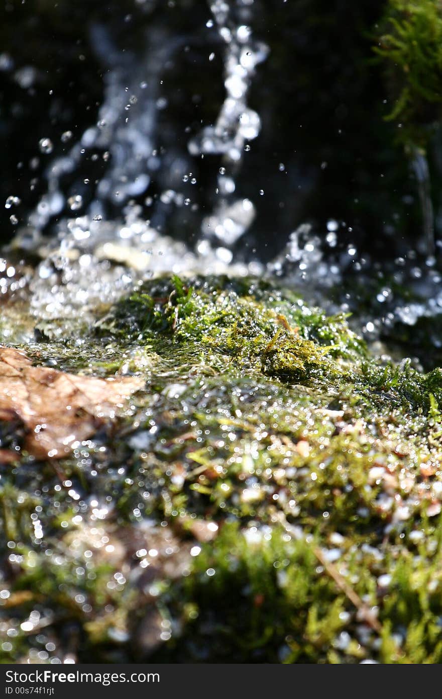 Stream of water falling downwards. Stream of water falling downwards