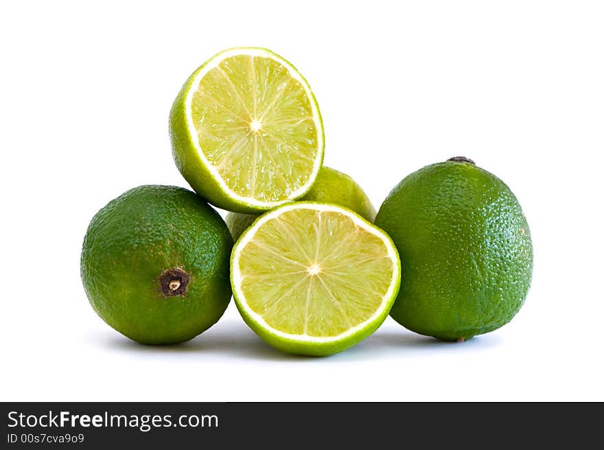 Fresh green limes isolated on white. Fresh green limes isolated on white