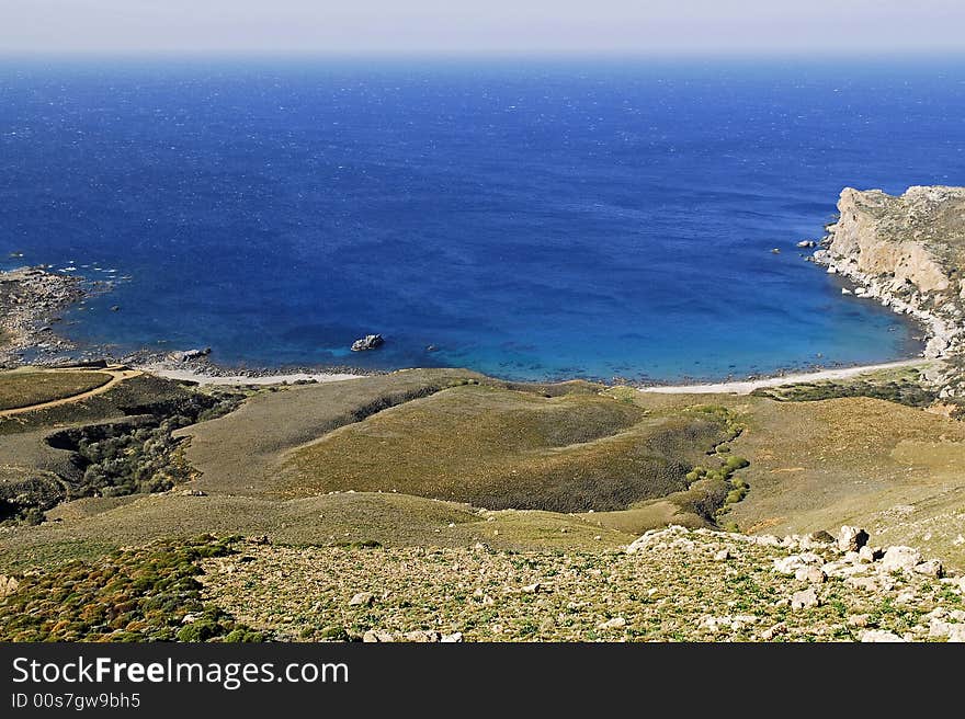 A small bay with clear blue water of the mediterranian sea in crete