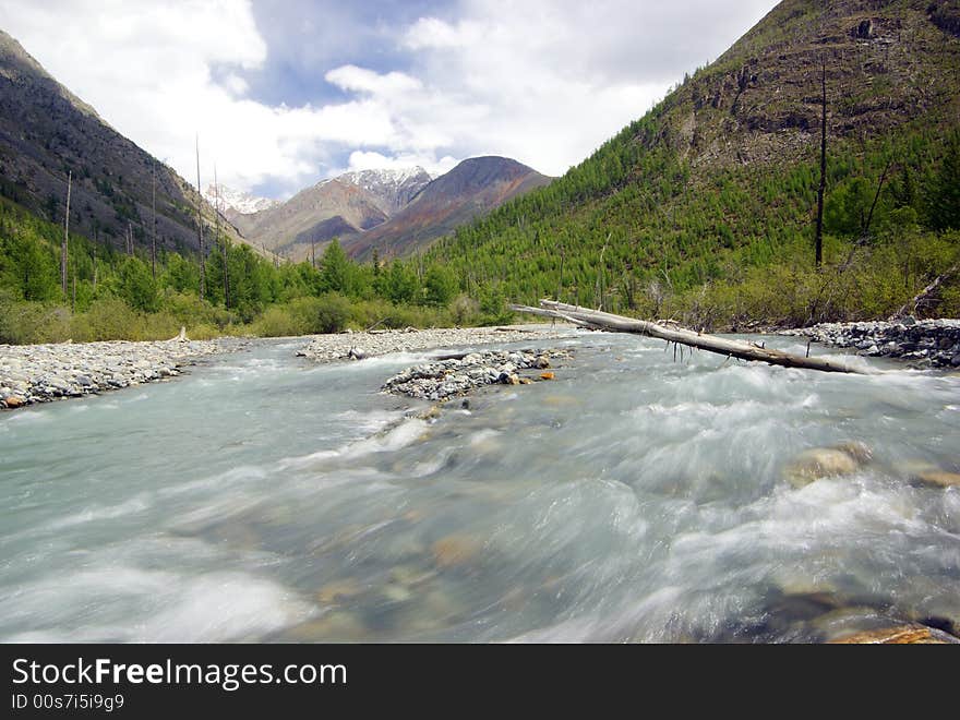 In the centre of mountain river. In the centre of mountain river