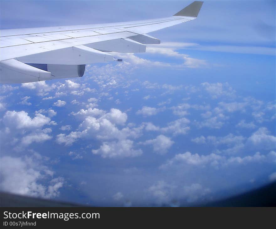 Wing above clouds