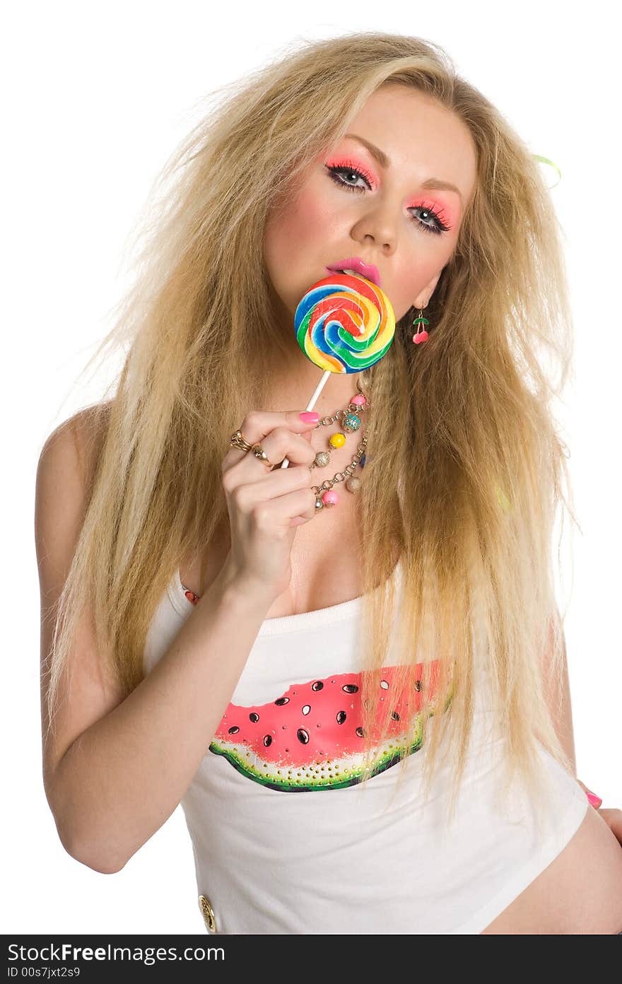 Glamorous blond with heavy makeup holding a lollipop isolated on white