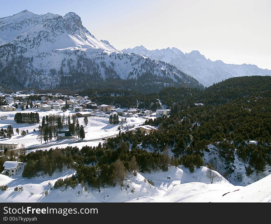 Snowy village in the Alps (switzerland - Maloja)