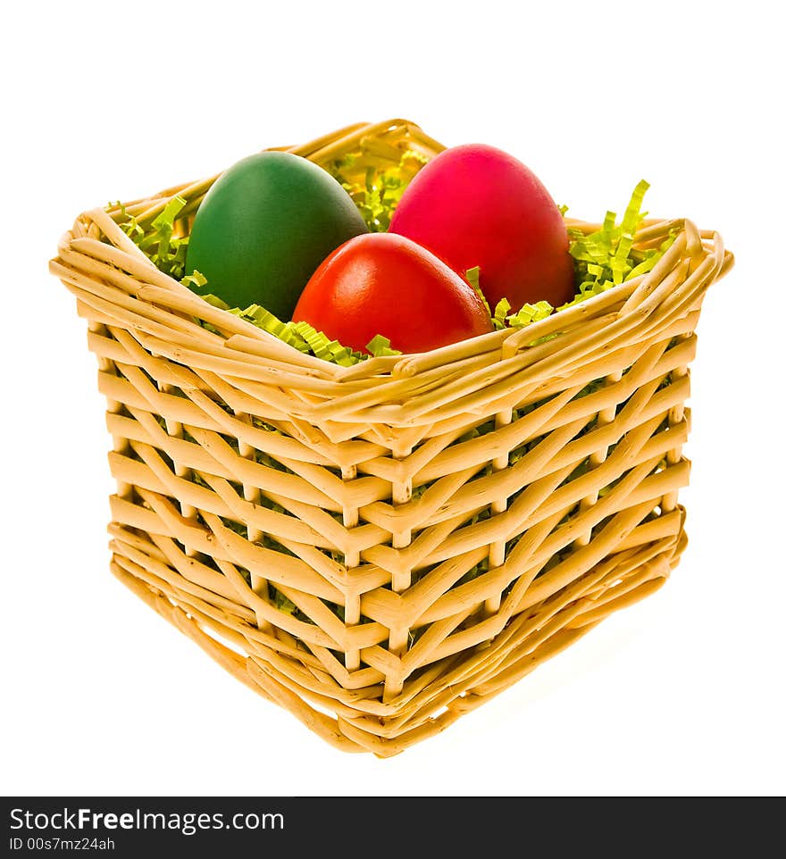 Multi-coloured eggs in a basket