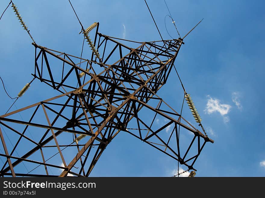 Power line pole over blue sky background