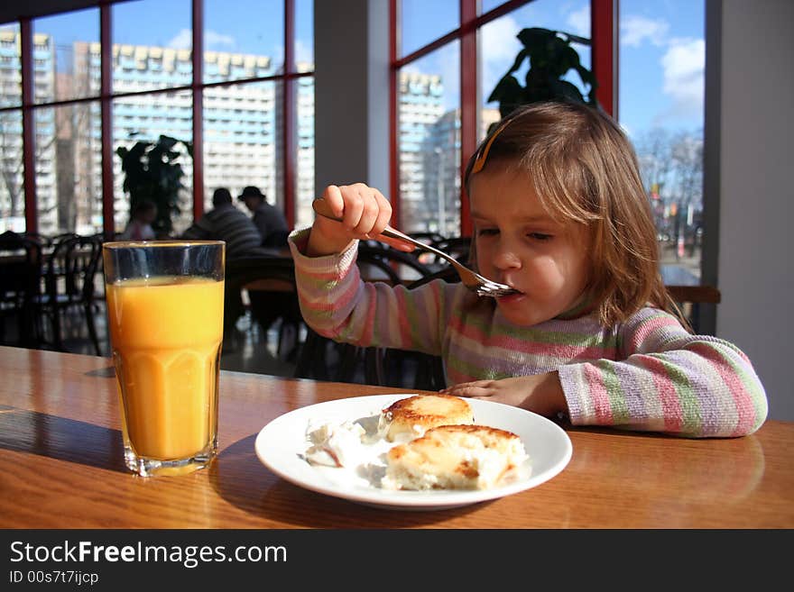 Girl Eating Cheese Cake With A Fork